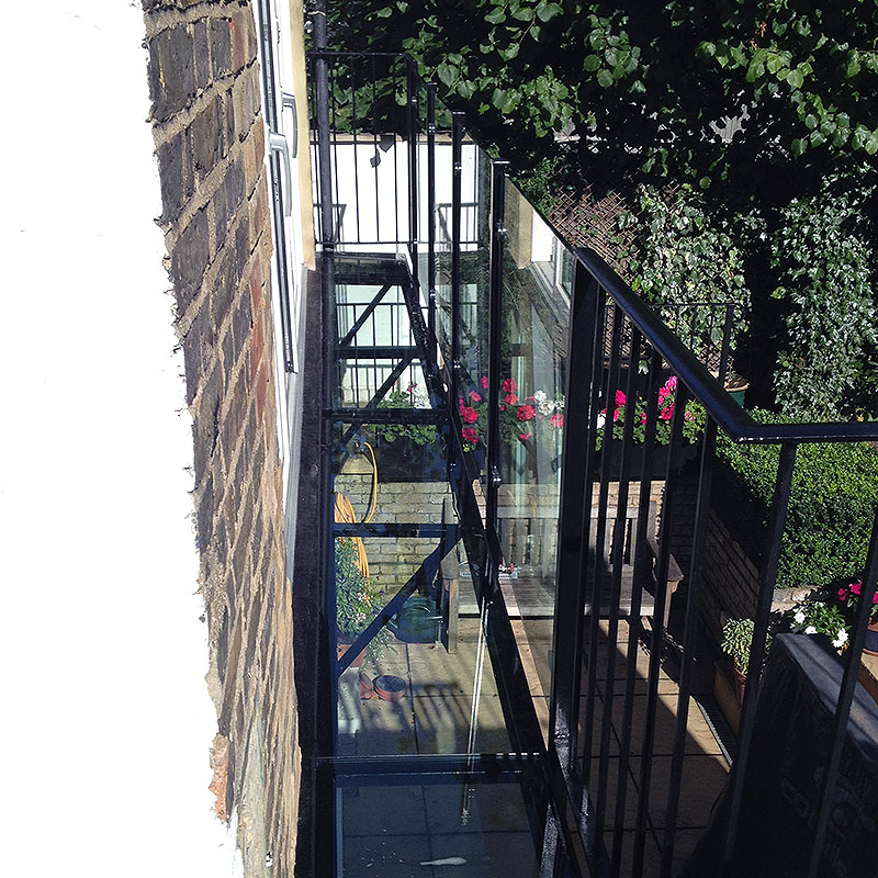 Glass balustrades on first floor exterior balcony in London