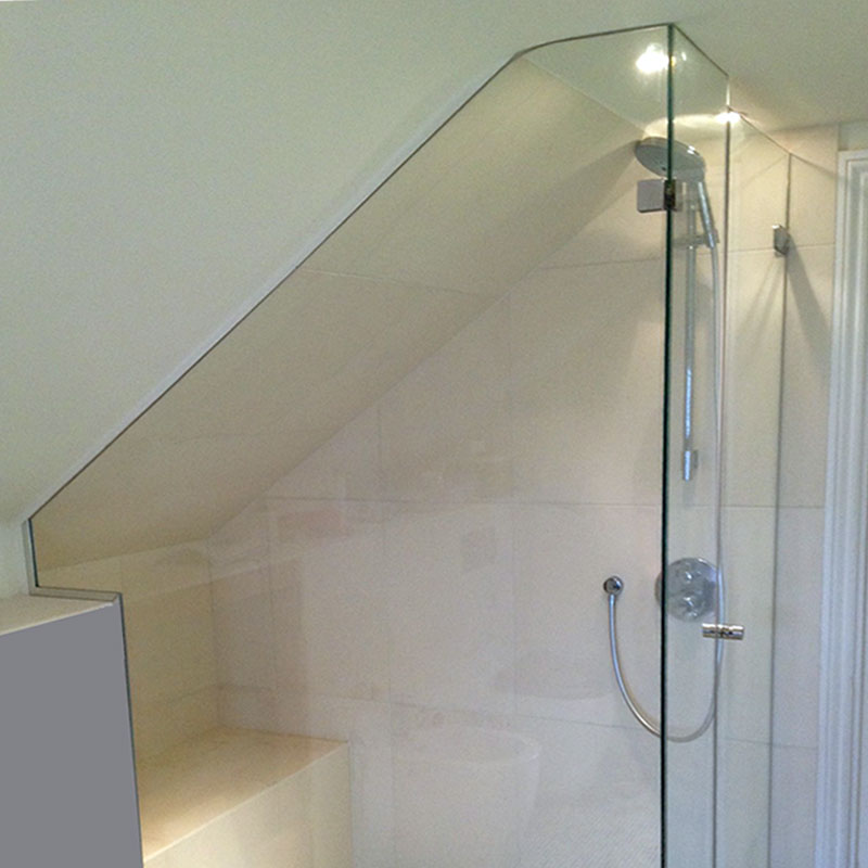 Shower glass cut to match curve of the roof