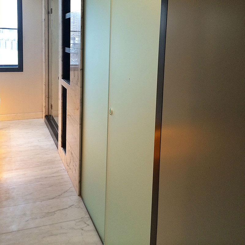 Sliding frosted glass door in corporate setting