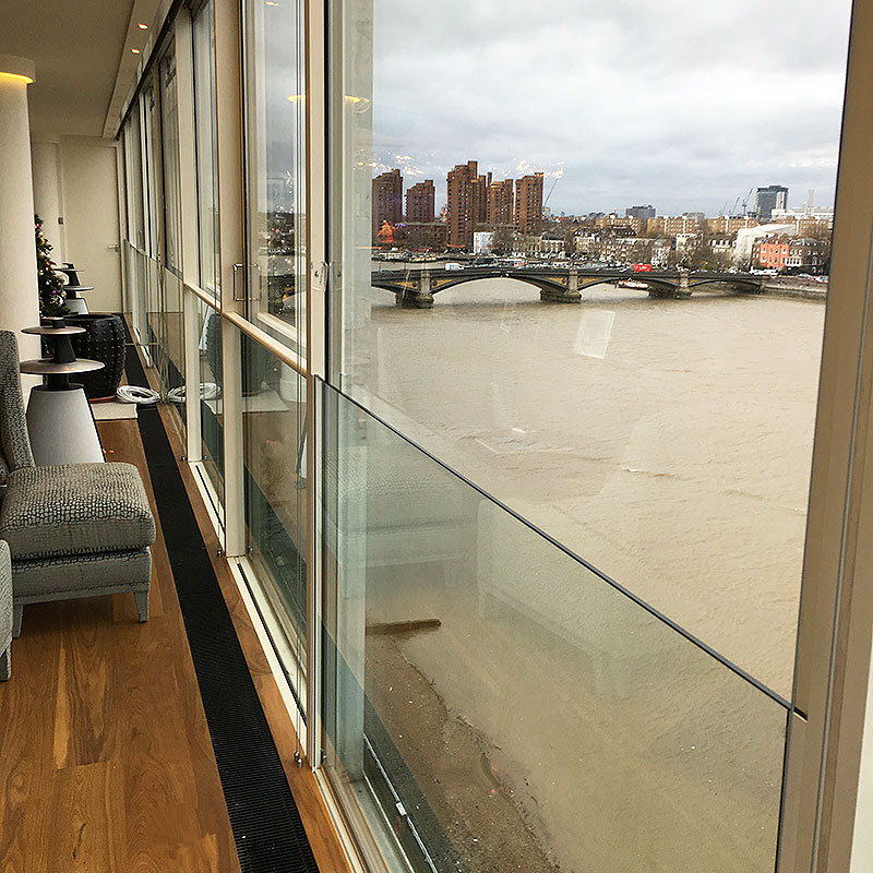 Glass safety balustrade on windows overlooking the River Thames in London