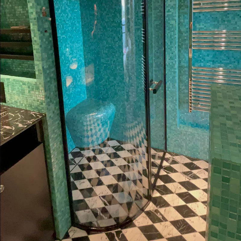 Curved glass shower surround