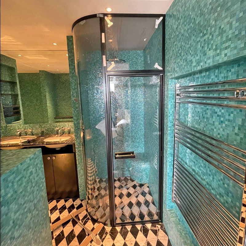 Curved glass shower surround
