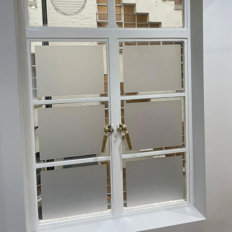 Frosted glass panels on bathroom window