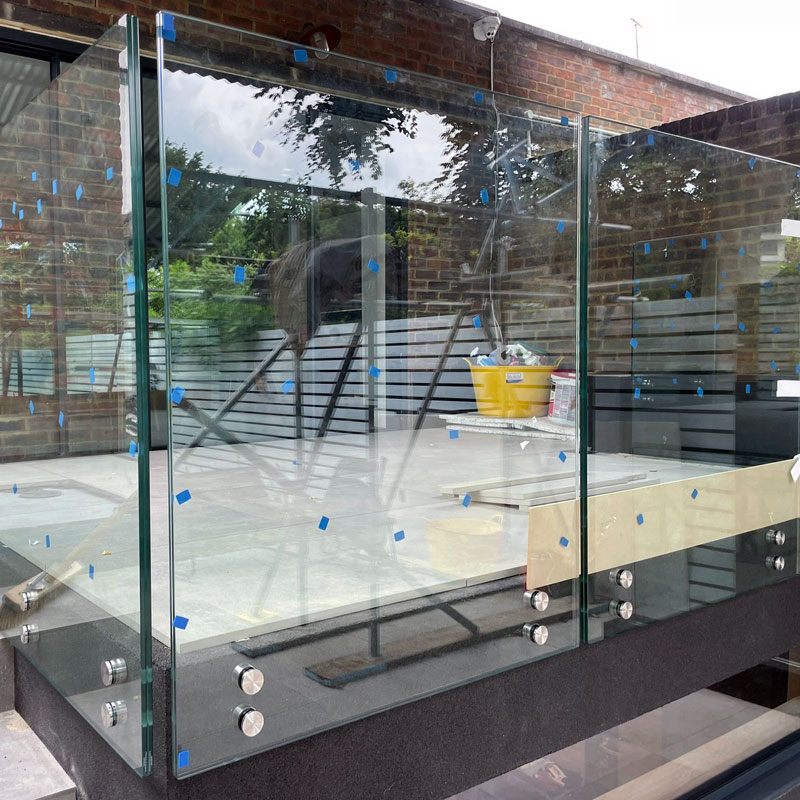 Bespoke glass balustrade being installed