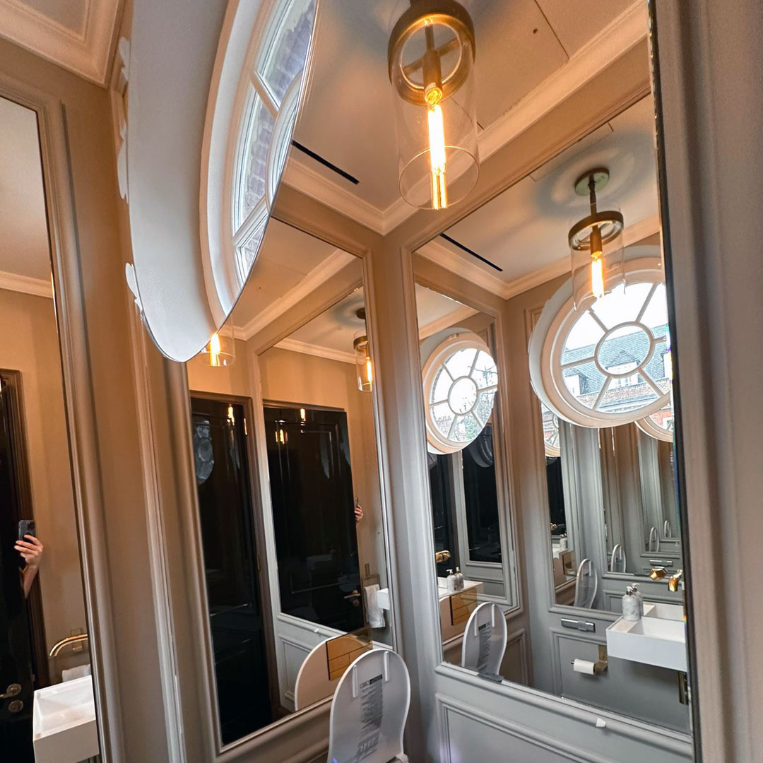 Bespoke bathroom mirrors, complimenting the natural features of the house in Knightsbridge