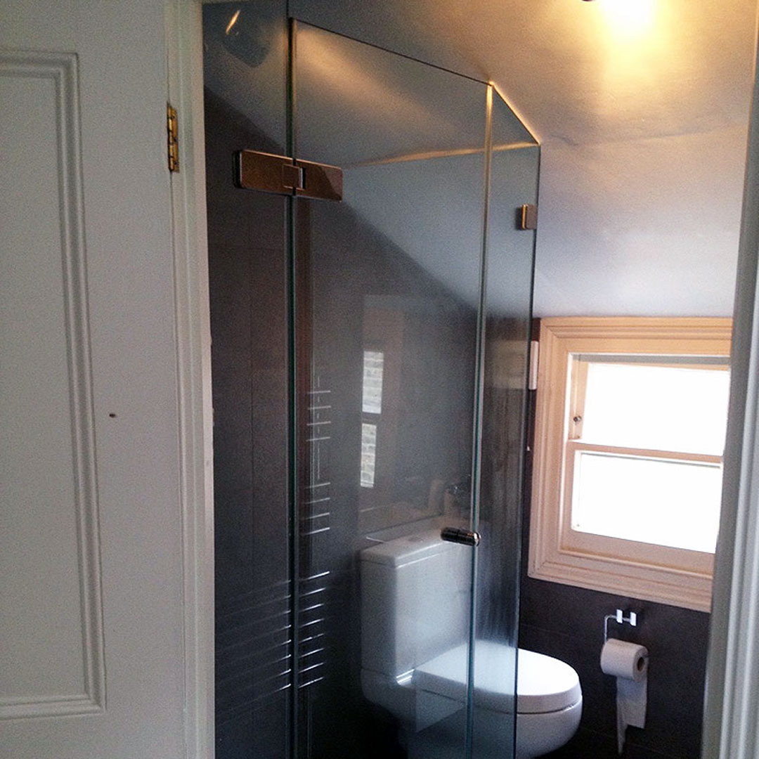 A shaped shower designed to fit in with the features of the room, Chiswick