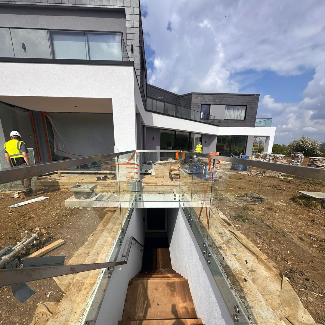 A glass stairway balustrade at a new build property in London