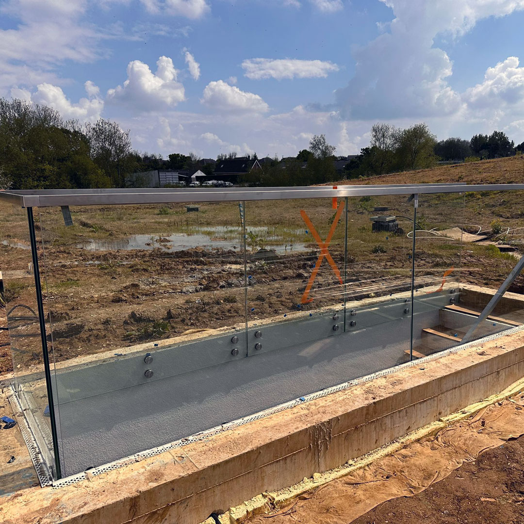 A glass stairway balustrade at a new build property in London