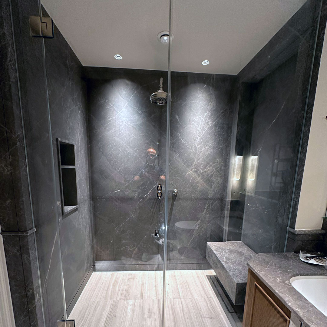 Large wetroom with bespoke frameless glass doors