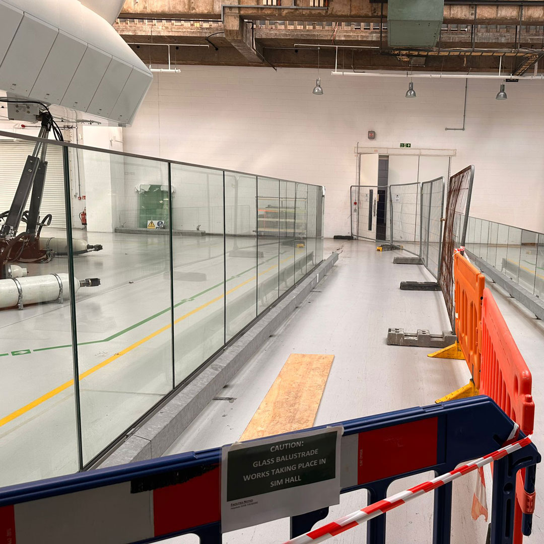 Bespoke glass balustrades in the flight simulator hall at London Heathrow Airport