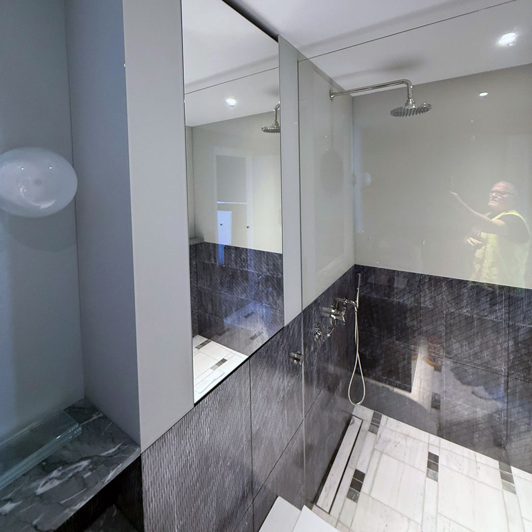 Bespoke shower glass in and a mirror